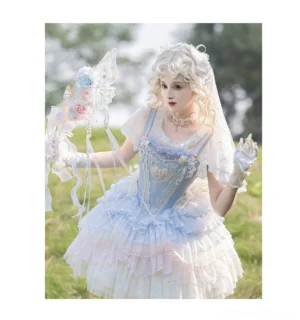 dreamy ballet lolita jsk jumper skirt front three-quarter view with grey-blue gradient white tulle embroidered bust lace ruffles flower motifs pearl bow shoulder straps bridal styled model outdoor grassland
