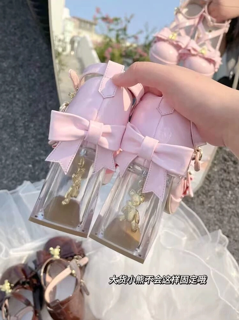 Dreamy bear sweet lolita heels showcasing gold detachable bear charm on ruffled bow, close-up detail shot, removable decorative bear ornament, patent leather surface, premium PU construction