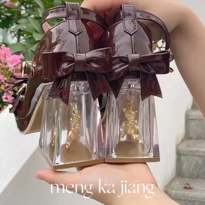 Sweet lolita platform heels transparent heel detail showing embedded bear charm in action, clear PU heel with moving bear ornament, dynamic heel feature demonstration, innovative embedded charm design