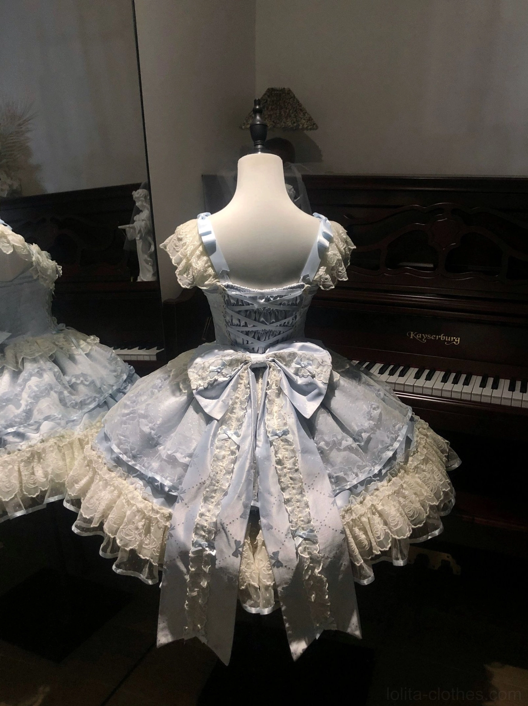 Sweet lolita JSK dress styled with fishbone petticoat displaying dramatic bell-shaped silhouette and maximum volume ideal for lolita events, conventions, and formal occasions