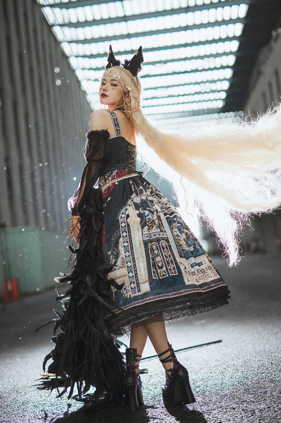 Dark gothic Egyptian Lolita JSK dress back view showing tiered flounce and vintage architecture print details