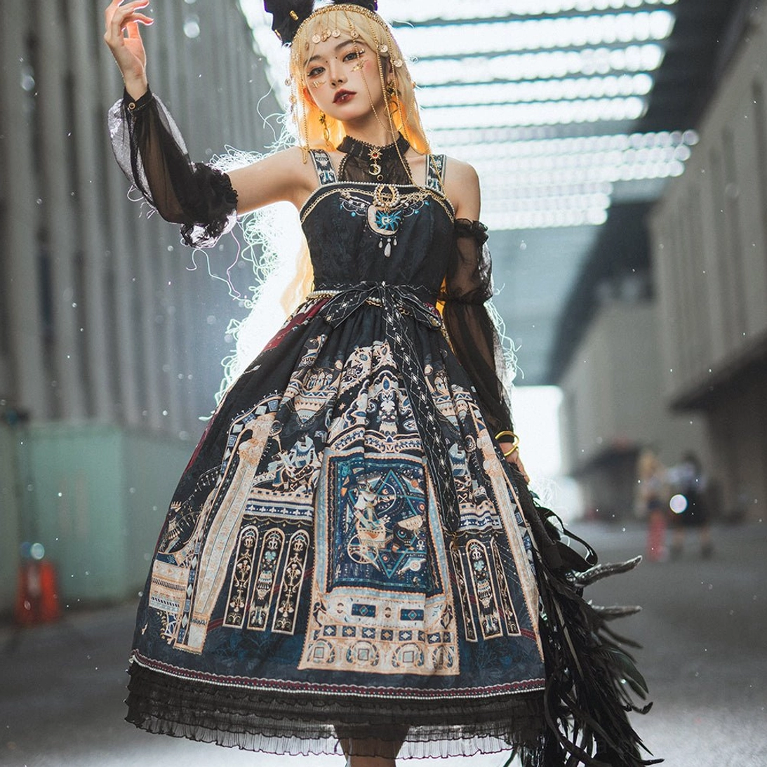 Dark gothic Egyptian Lolita JSK front facing with complex vintage architecture print and feather trim details