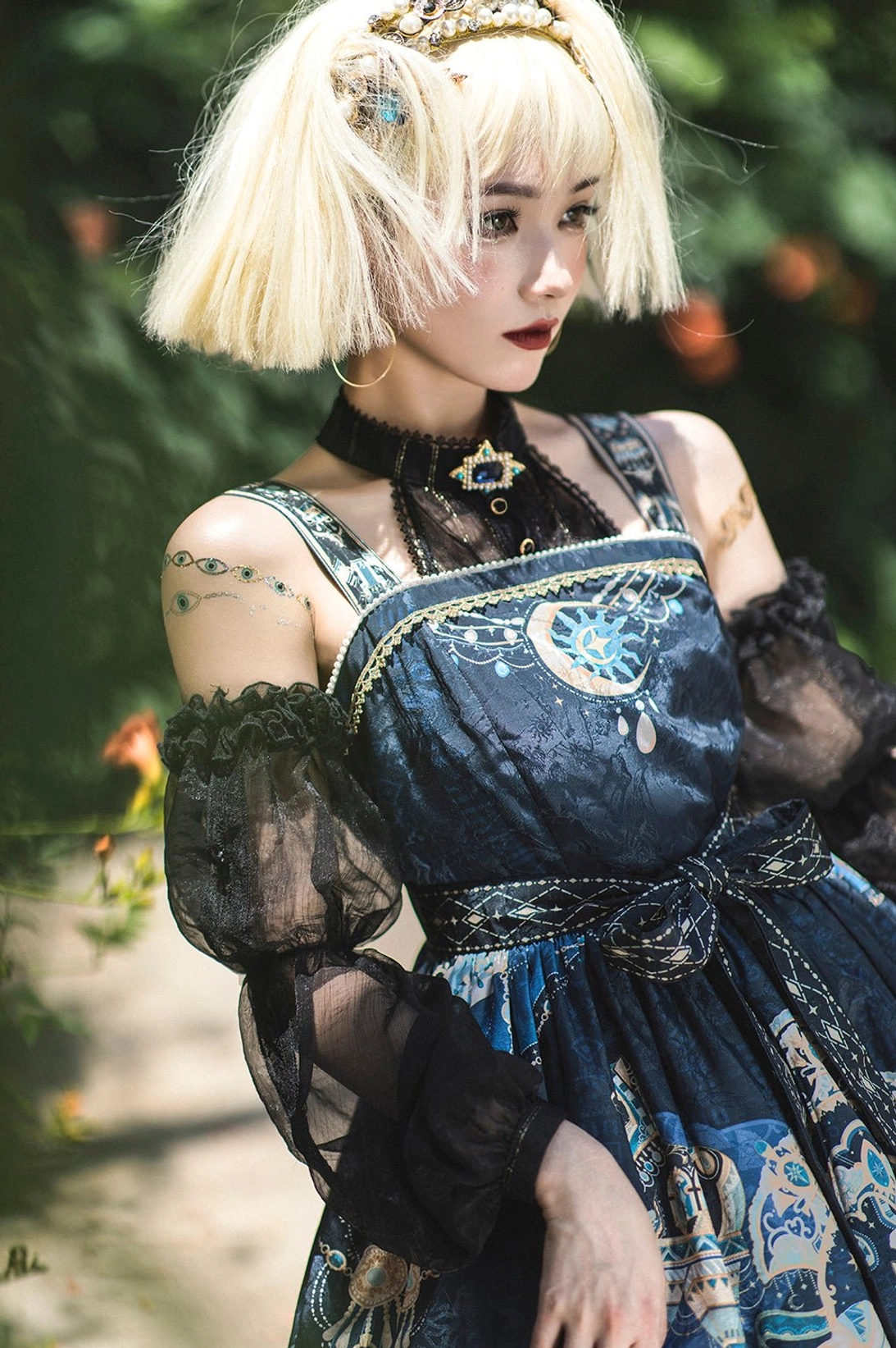 Close-up detail Egyptian Lolita JSK upper body sheer mesh sleeves neck pendant waist sash and celestial print