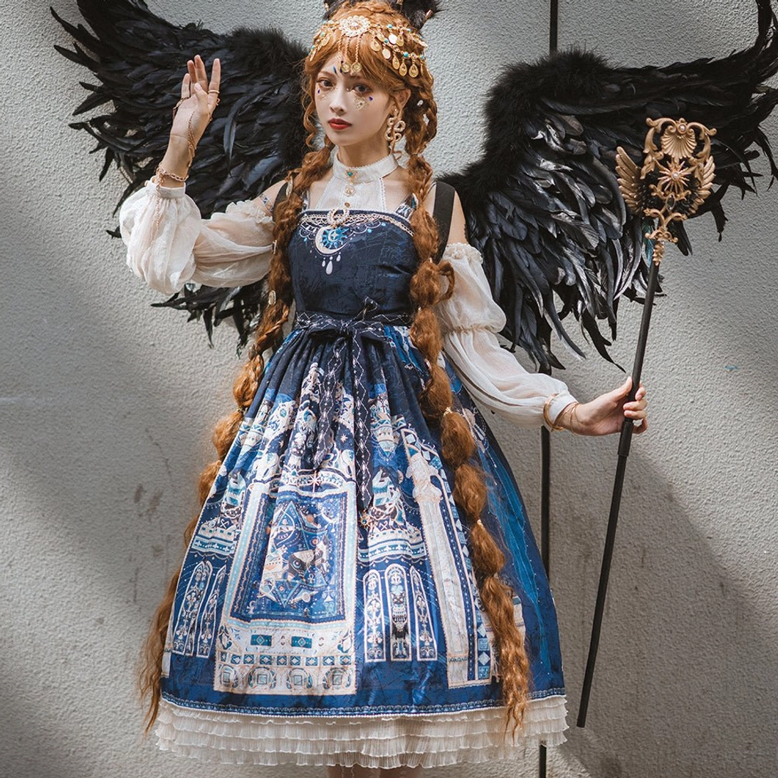 Navy Egyptian Lolita JSK with white inner blouse front view featuring matching celestial print and lace ruffled hem