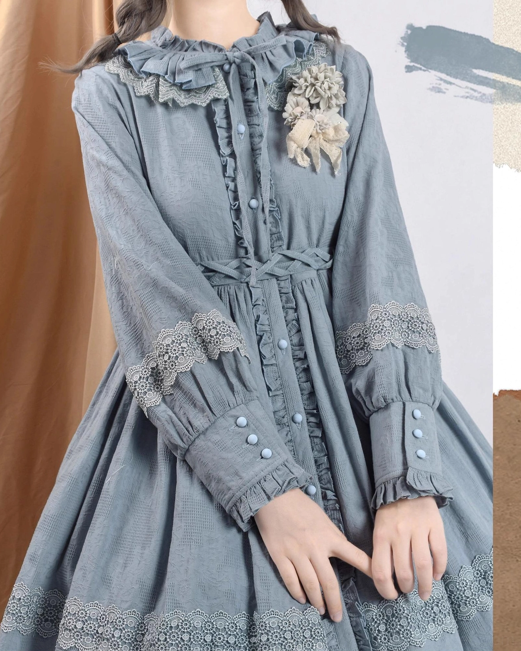 dusty blue lolita dress close-up upper body torso showing jacquard woven fabric button details lace trimmed cuffs decorative buttons
