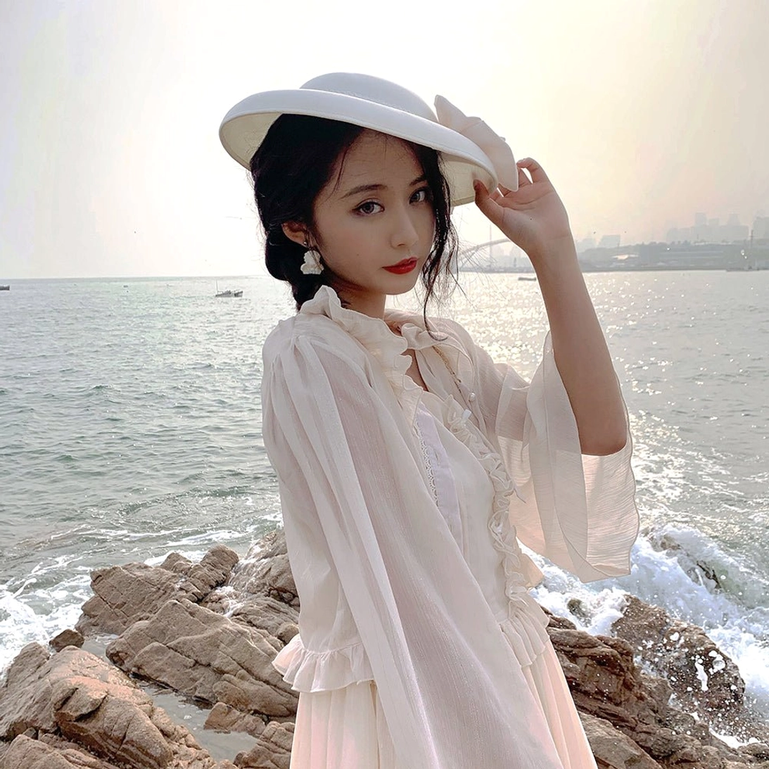Dusty rose pink lolita cardigan romantic styling showcasing delicate ruffled details, dimensional silhouette, and elegant chiffon drape for sweet lolita fashion coordination