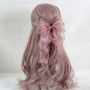 Dusty rose pink sheer organza lolita headdress bow clip on pinkish-brown wavy hair mannequin, back angle showcasing flowing ribbon tails and delicate bow structure