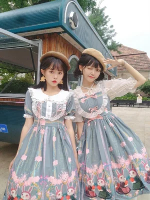 Dusty teal-blue Caesious Bunny printed Lolita OP one-piece dress with white peter pan collar and pink ruffled trims featuring cartoon bunny and floral skirt print in retro food truck outdoor scene