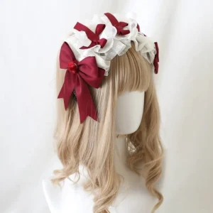 Elegant lolita headdress three-quarter side view featuring intricate white frilled lace trim with multiple arranged wine-red satin bows on blonde curly wig