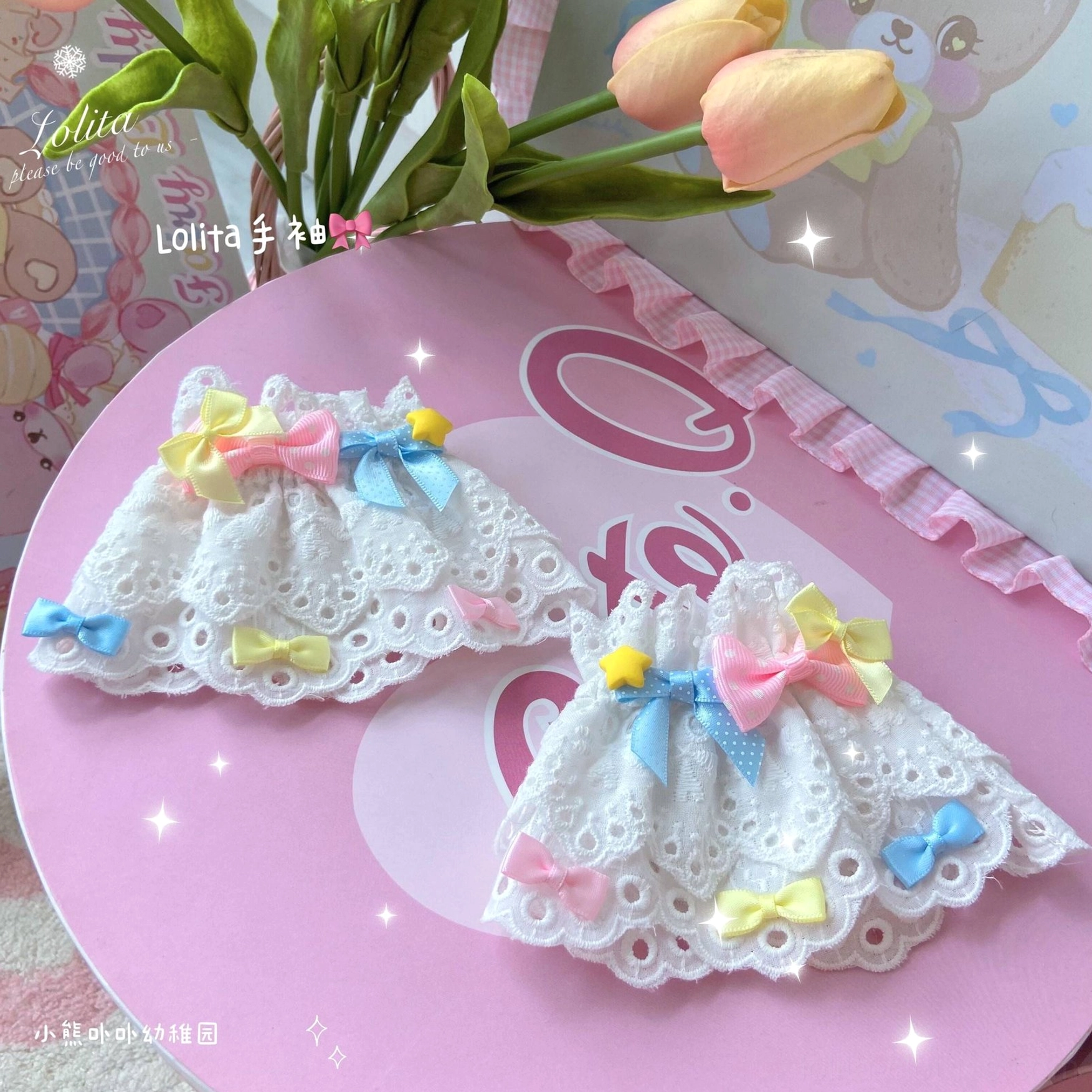 embroidered heart and bow accent details on white lace wrist cuff with multicolor pastel satin bows