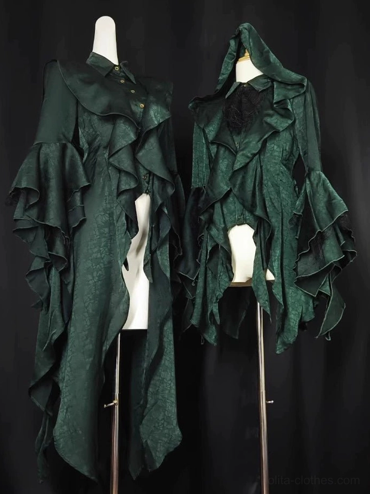 Two emerald green Ouji Lolita coats on dress forms showing contrasting designs - one with stand collar and one with attached hood, ruffled flared princess sleeves, jacquard woven fabric texture