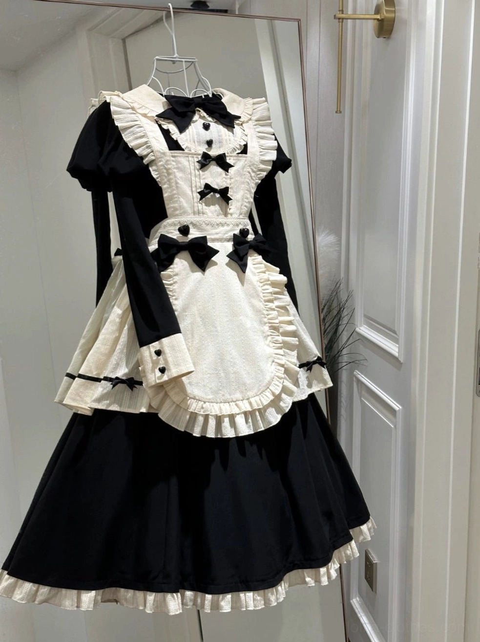 Enchanted maidette halloween lolita OP dress with apron back view showing peter pan collar detachable bow tie construction and fabric details