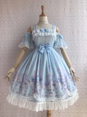 Sky blue enchanted unicorn garden summer lolita jsk dress with off-shoulder ruffle sleeves, lace trim neckline, front waist bow, white ruffled hemline, and whimsical fantasy print skirt displayed on dress form front view