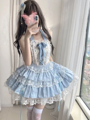 Endless Summer ballet sweet lolita skirt set front three-quarter mirror selfie view featuring sky blue halter bodice with decorative satin lacing and multi-layered ruffled lace skirt worn by model with long dark hair