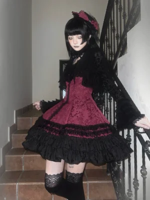 Burgundy and black Gothic Lolita jacquard JSK dress with ruffled bodice, bell sleeves, and tiered skirt design