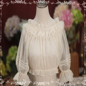 Apricot ethereal dot mesh ruffle lolita blouse front view on mannequin with floral background showing ruffled crew neckline and bell sleeves