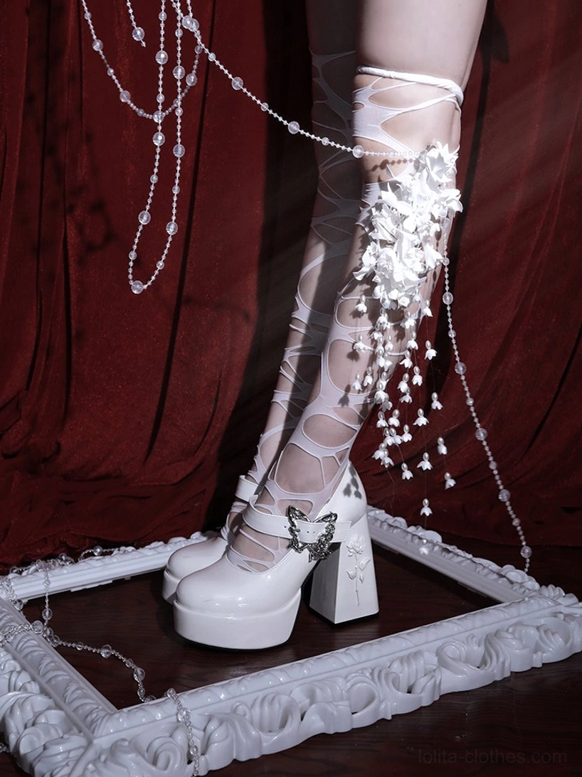 Glossy black Mary Jane platform Lolita heels demonstrating round toe silhouette and shallow cut design for flattering feminine foot appearance