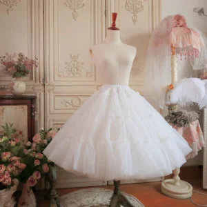 Petticoat four-layer tiered tulle structure close-up front view on mannequin, showing neat organza layers creating exaggerated bell silhouette with classical furniture background