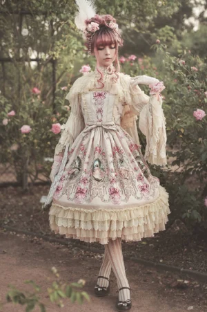 Fairytale garden classic lolita jumper skirt full body front view model wearing beige floral print tea party dress with ruffled lace hem in outdoor rose garden setting