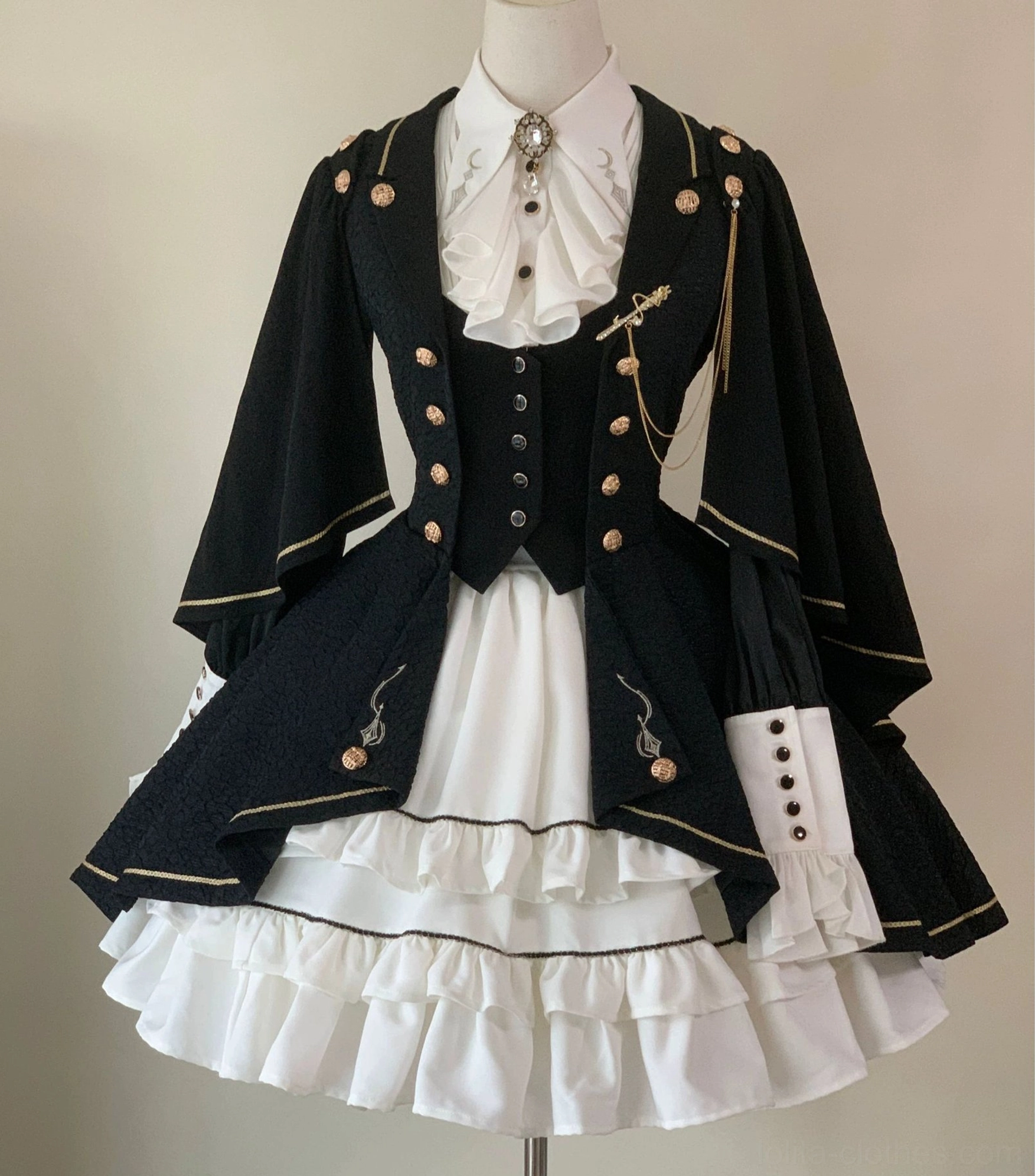 Fallen Moon Rule military lolita ensemble back view detail, showing adjustable waist buckle mechanism and cape sleeve attachment points on mannequin