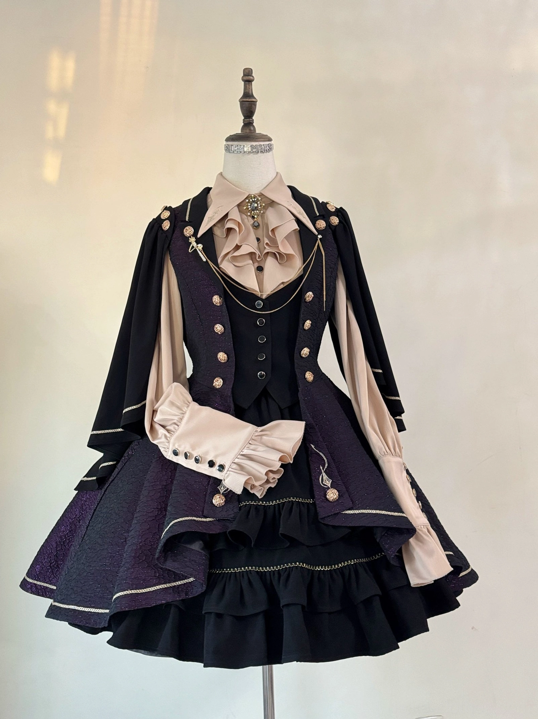 Fallen Moon Rule military lolita blouse front detail, showcasing embroidered collar, button closure, ruffled placket, and flounce trim construction