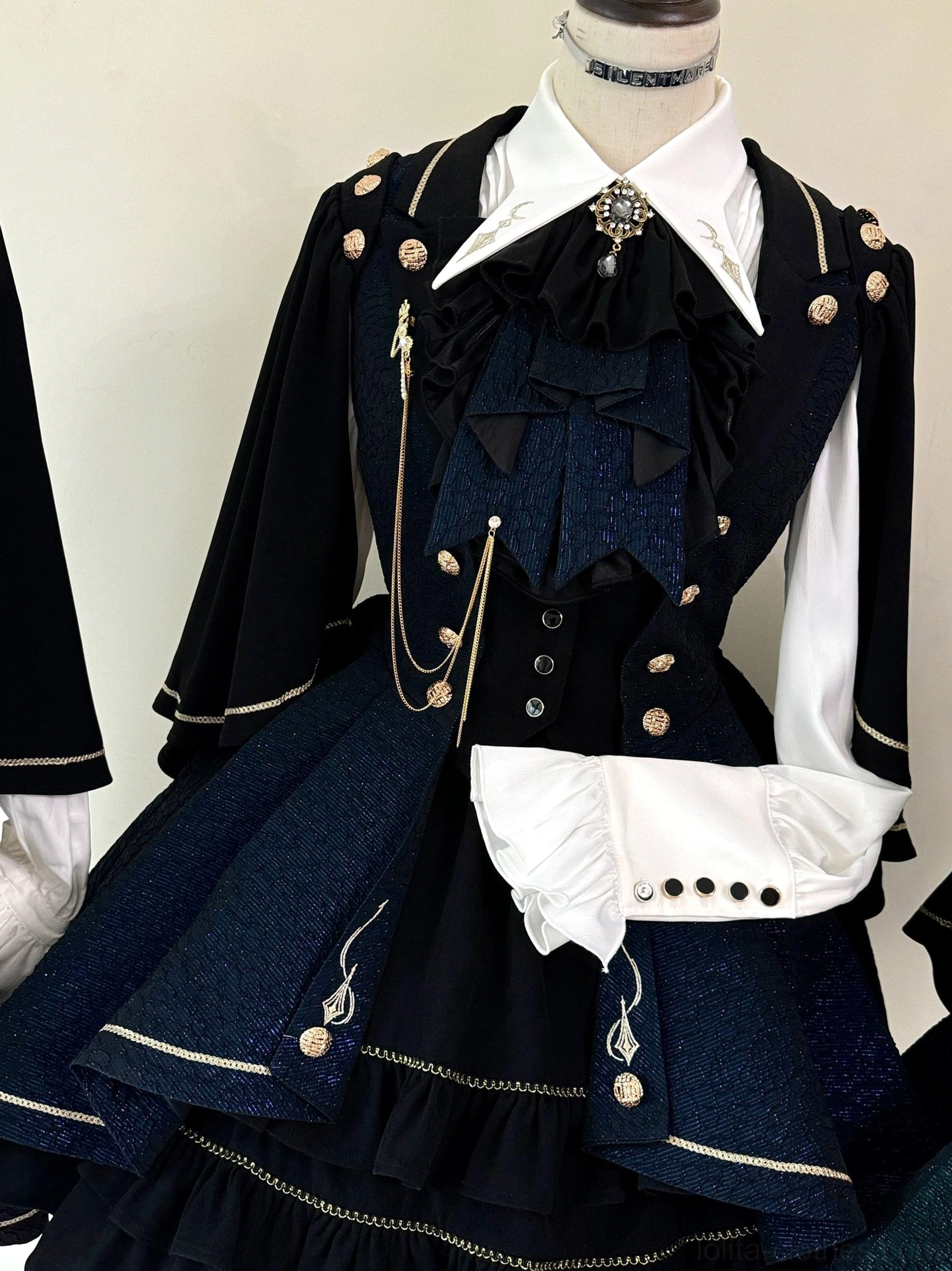 Fallen Moon Rule military lolita with detachable cape sleeves displayed separately and attached, showing versatile styling options on mannequin