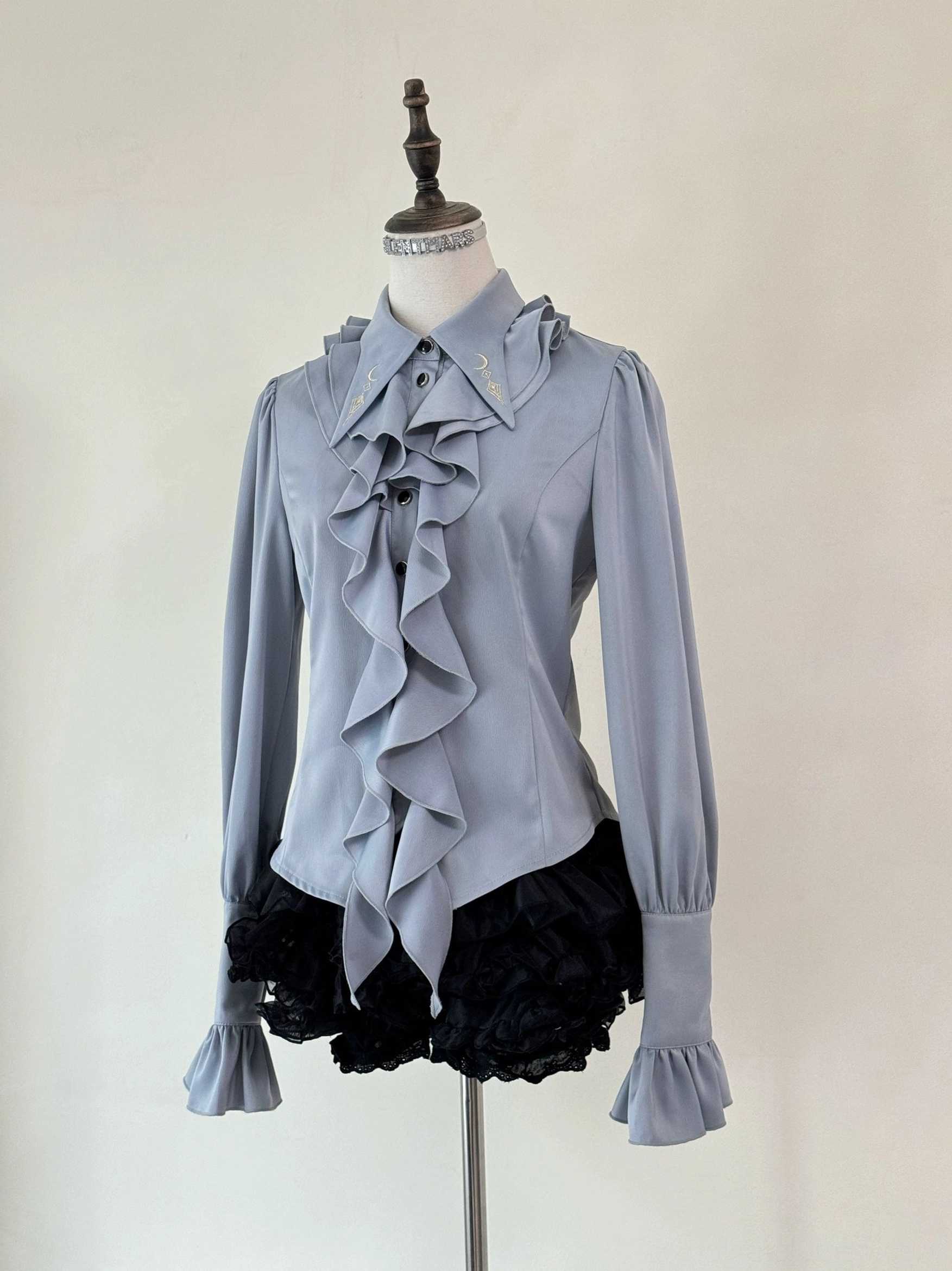 Fallen Moon Rule military lolita in different light settings, showing how fabric sheen and color appears under various lighting conditions