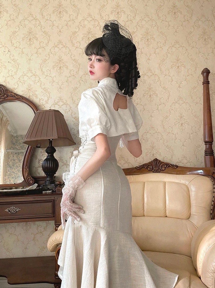 Fishtail ruffled Lolita JSK dress in white and black color variations, showing adjustable chest bow design and elegant silhouette suitable for Lolita tea parties and social gatherings
