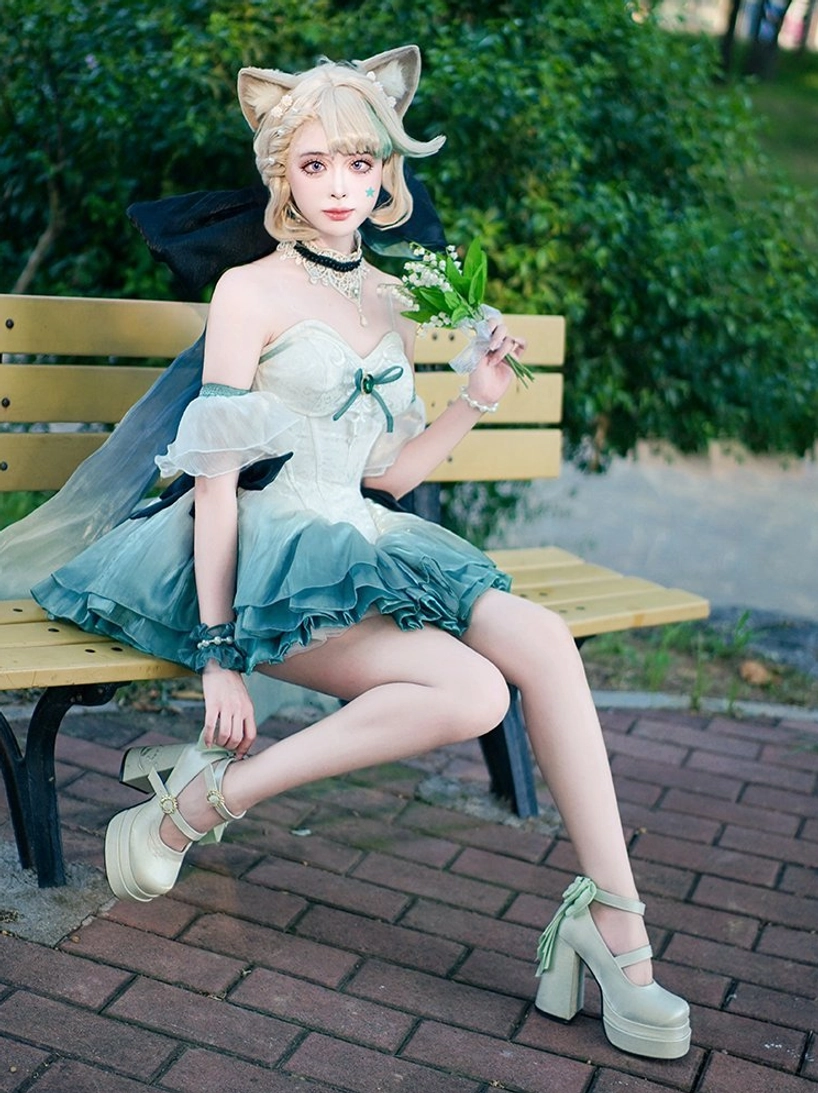 Light mint green lolita high heels worn by model in full fairy dress lolita outfit with cat ear headpiece, full-body outdoor shot on park bench, complete elegant lolita coordinate