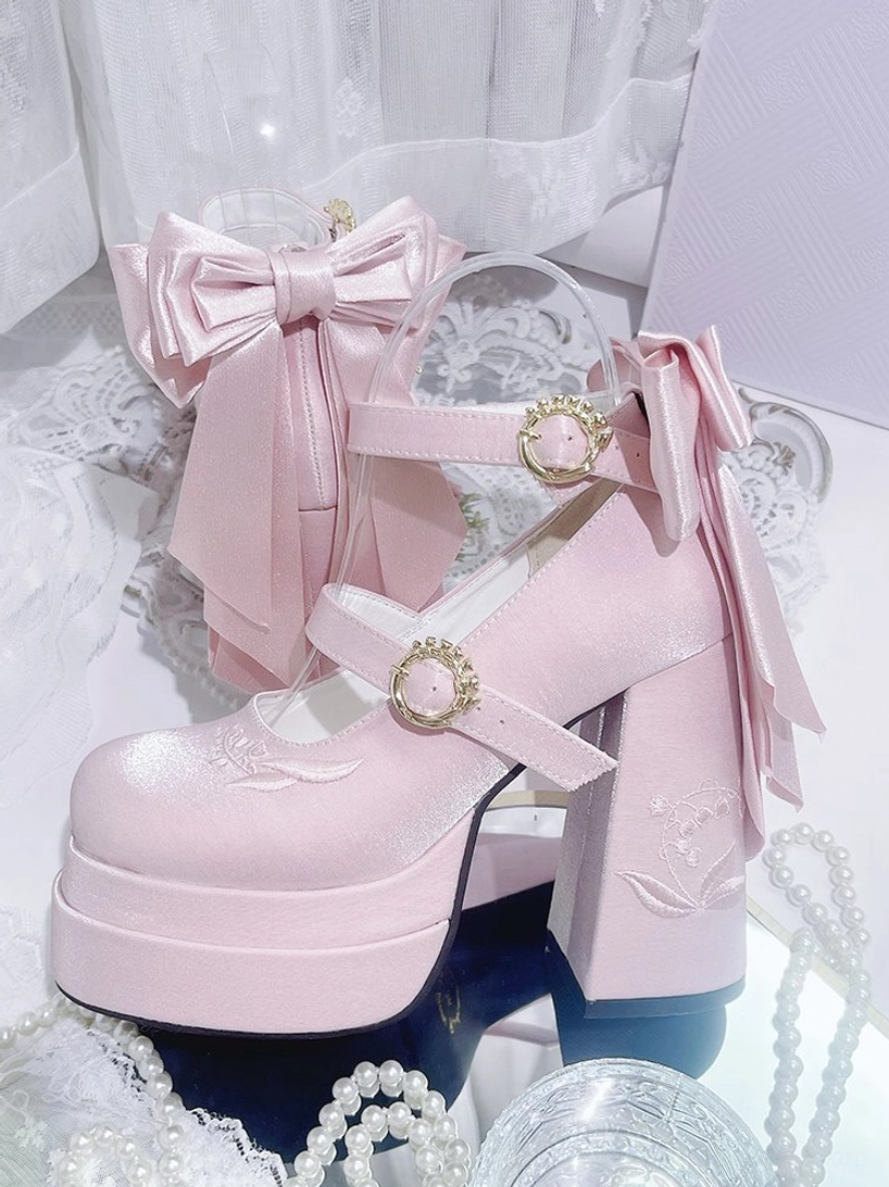 Pastel pink lolita Mary Jane platform heels with detachable satin bow and gem-set buckles, worn with coordinating ruffled socks for complete sweet lolita look