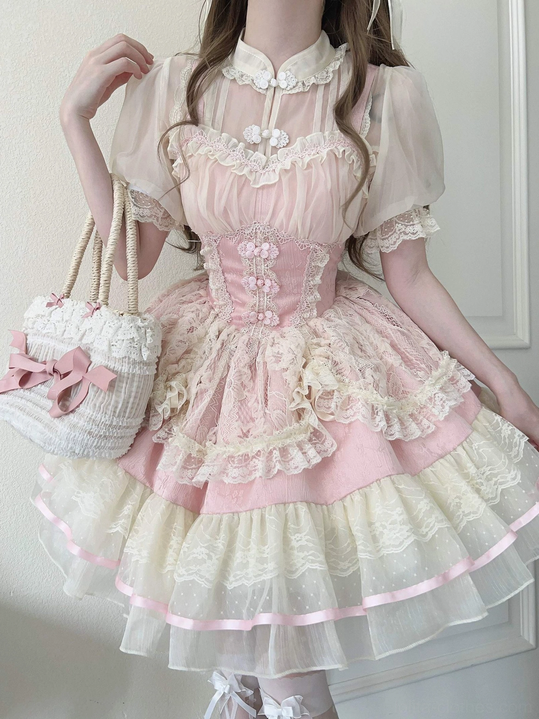 Pink cream chinese lolita jsk dress side three-quarter view with stand collar sheer puff sleeves and delicate lace bodice