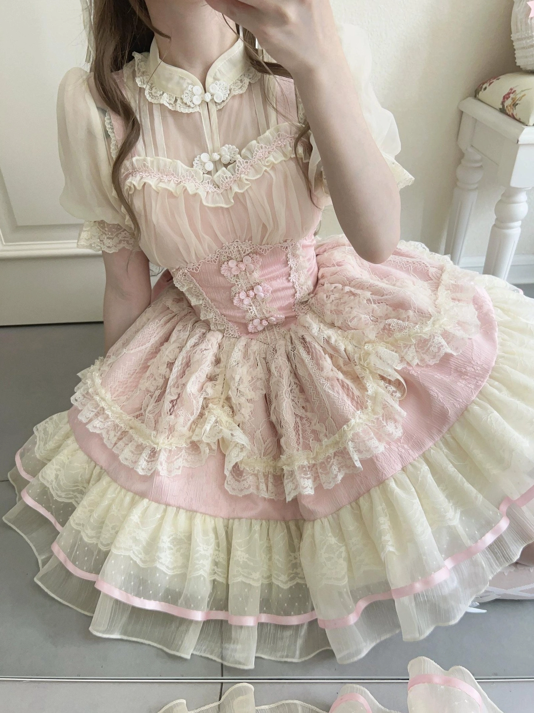 Pink ballet core lolita jsk dress top-down view showing floral appliques on corset and cream pink layered skirt with ribbon trim