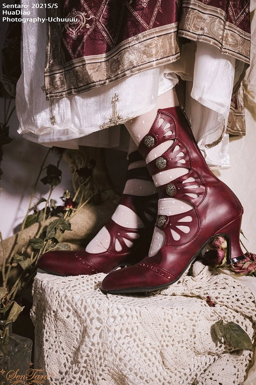 Handcrafted floral carved Mary Jane Lolita ankle boots worn by model with white lace socks and burgundy leather upper showing multi-buckle strap system