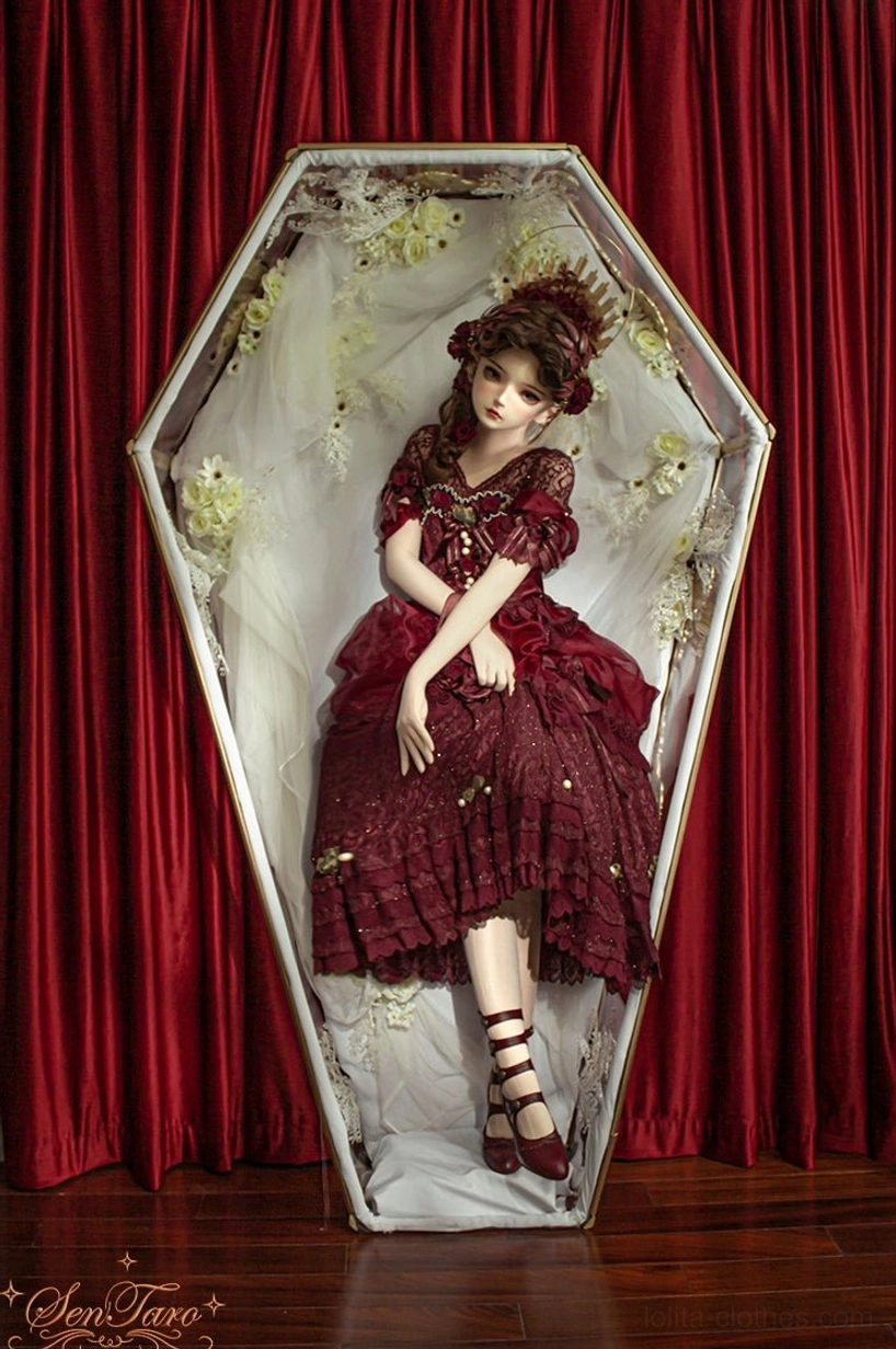 Floral carved Mary Jane Lolita ankle boots burgundy leather upper with wine glass heel and multi-strap buckle system side view fashion photography