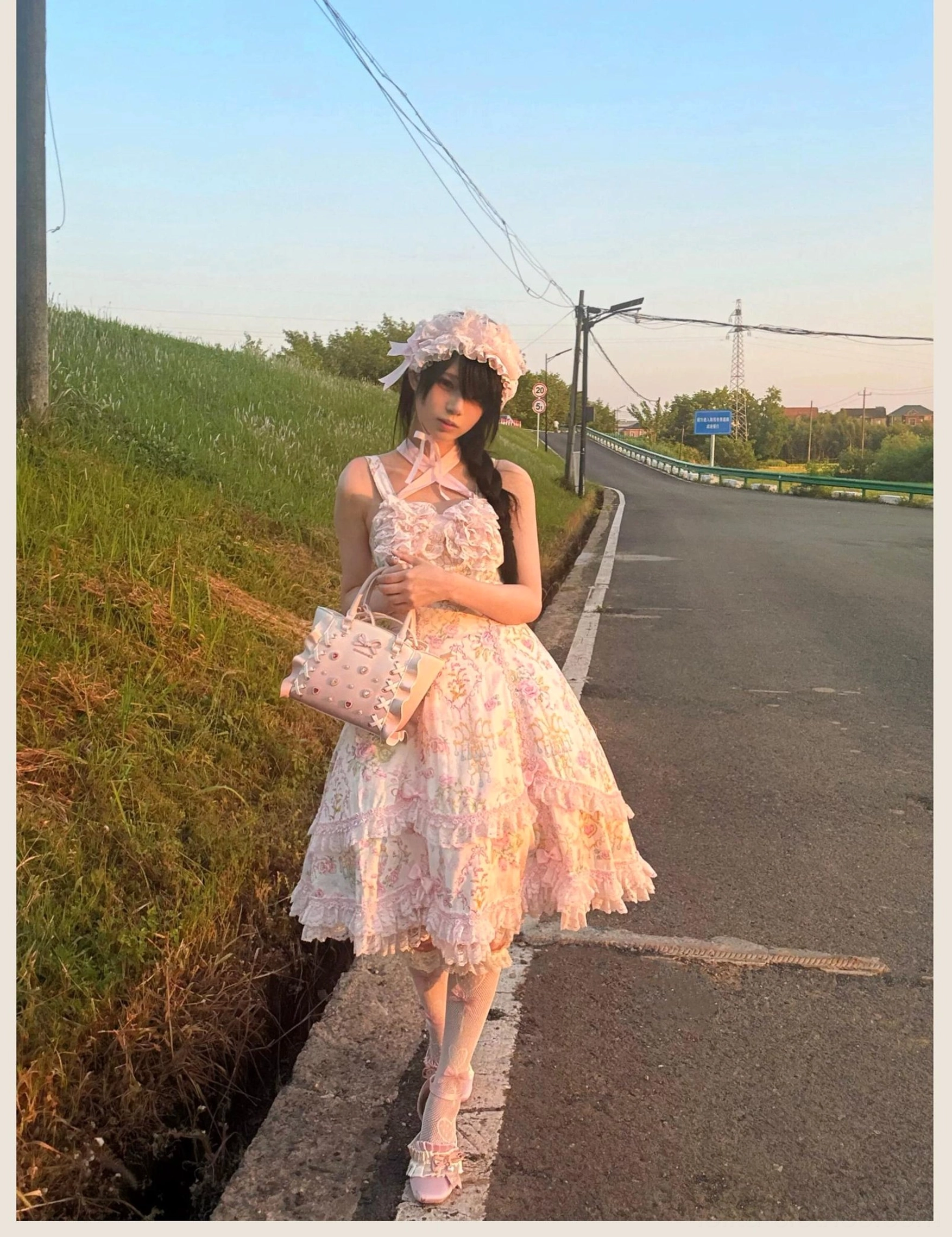 Floral Lolita JSK dress styled for tea party occasion with petticoat volume and romantic fairy-tale aesthetic appearance