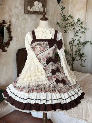 Floral Reverie vintage Lolita JSK dress on mannequin displaying brown and ivory color blocking detachable front bows and multi-layered ruffled skirt