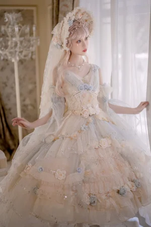 Flower Spirit Lake Blue Lolita JSK dress three-quarter front view with blonde model wearing flower veil headdress, cream champagne tone with 3D floral appliqués, shimmering glitter tulle tiered ruffled ballgown skirt in luxury vintage villa indoor setting