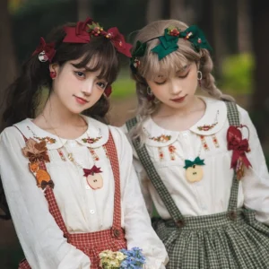 Forest-themed elegant lolita coordinate with doll collar blouses, plaid suspender skirts, and berry-adorned hair bows featuring decorative forest-inspired brooches and accessories