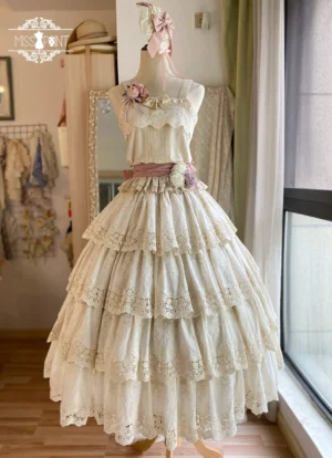 Cream beige Forest Waltz lolita camisole with tiered lace skirt pairing, pink waist sash, and floral decorative accents - full length mannequin display with wooden floor backdrop