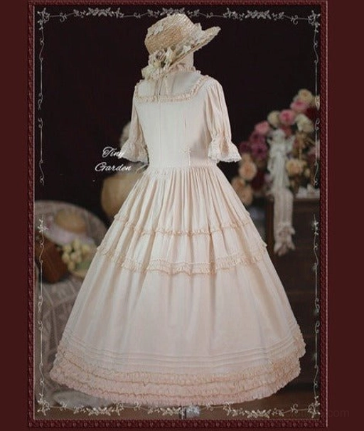 French elegance wine red vintage lolita dress with stand collar and elaborate ruffle details shown on mannequin formal presentation
