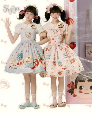 Fujiya Peko collab sweet lolita JSK dresses in blue gingham and pink colorways featuring Peko character and strawberry designs with twin-tail lolita models