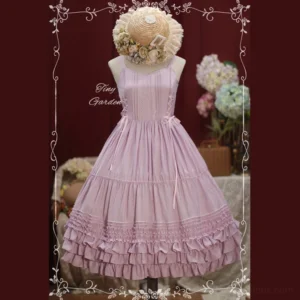 Apricot pink Lolita JSK jumper skirt front flat lay display with spaghetti straps side lace-up multi-layered ruffle tiered skirt pleated bodice elegant A-line silhouette