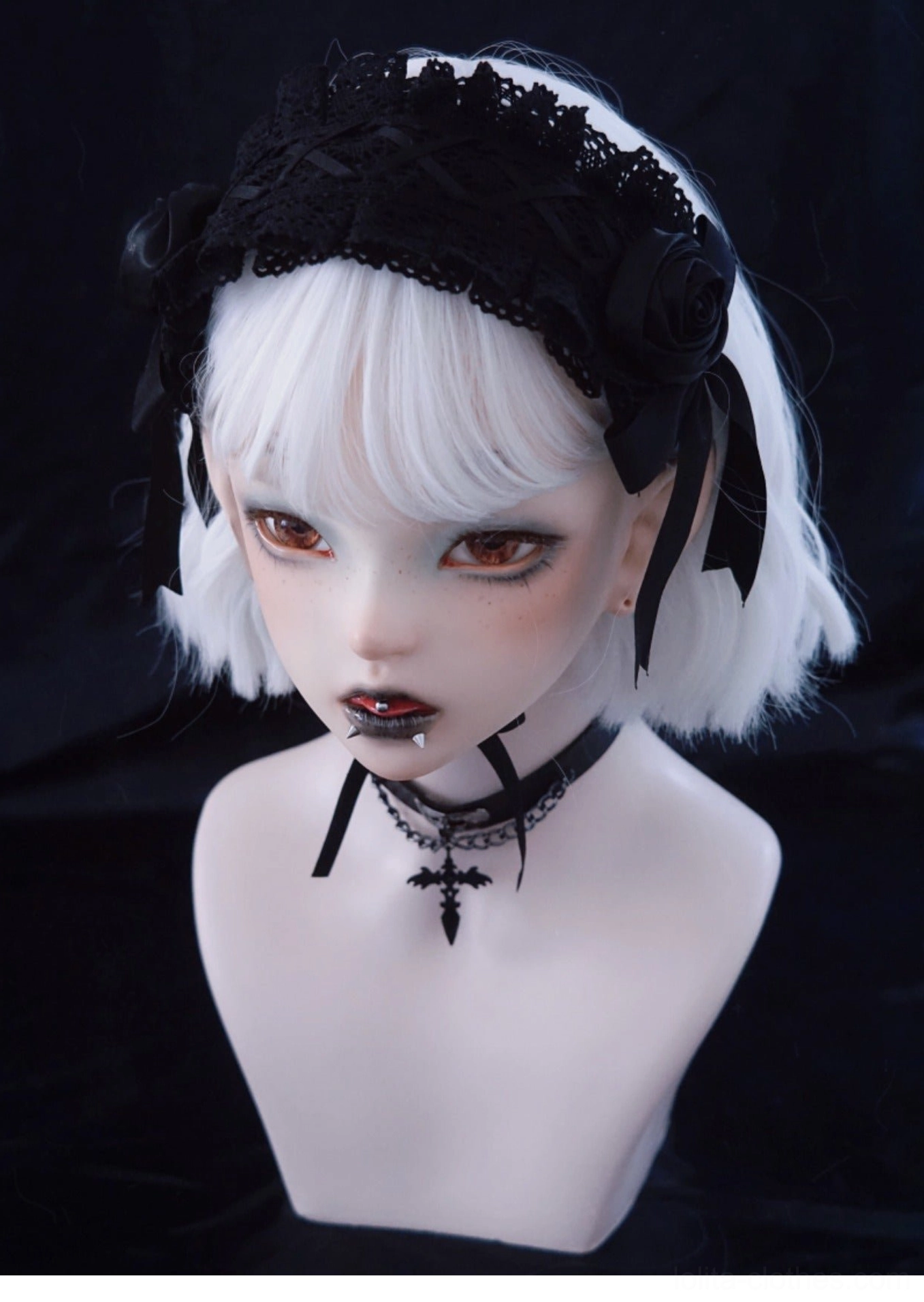 Gothic black rose lolita hairband three-quarter left view showing lace base and satin rose decoration with ribbons