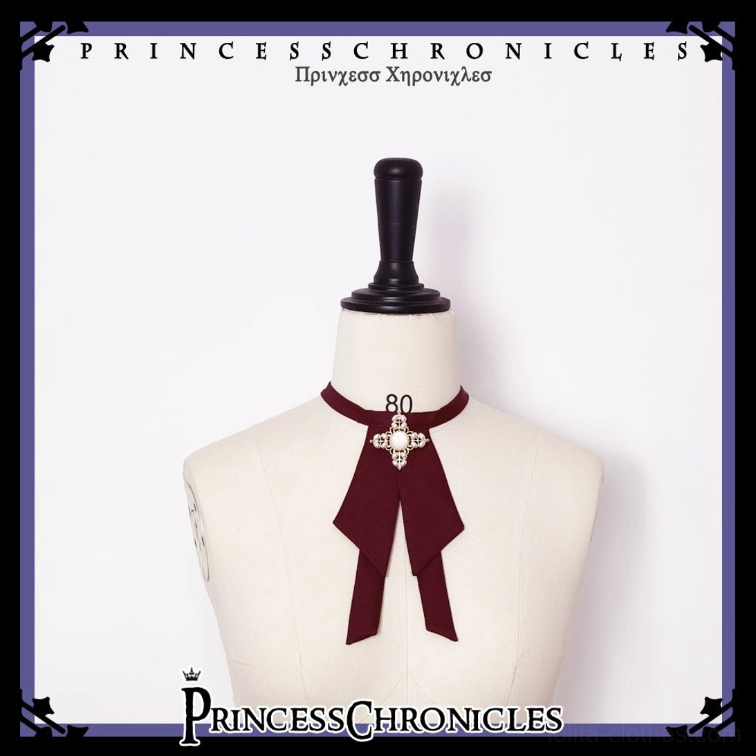 Gothic cross-decorated wine red bow tie accessory front static view dress form size 80 metal cross center ornament