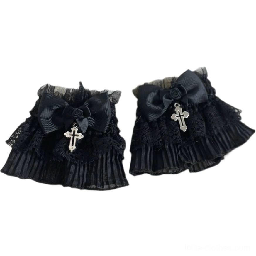Side view of Gothic Lolita black lace wrist cuff displaying pleated ruffle layers, black satin bow, fabric rose and cross charm
