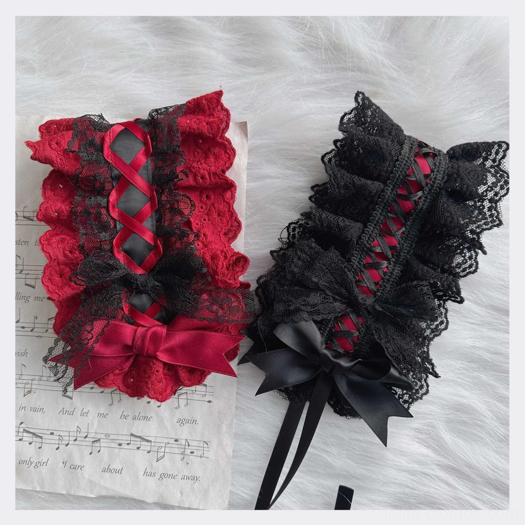 Pair of handmade Gothic Lolita black lace arm sleeves and headbands with ruffled trim, crisscross strap design and satin bow accent