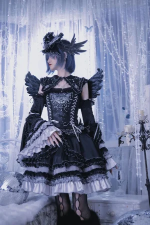 Black gothic lolita rhinestone corset top and tiered ruffled skirt set with detachable feathered wings and lace-up bodice front view