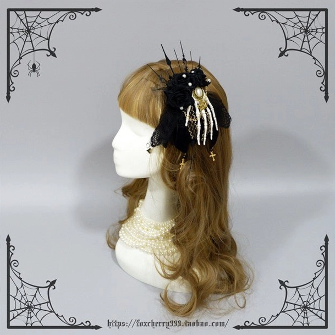 Black rose gothic skeleton hand hair clip mannequin side view white bone hand gold metal details cross charm pendant