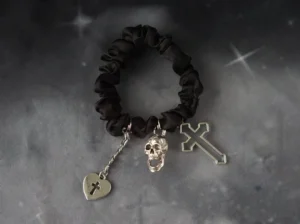 Gothic lolita black skull chain hairband with silver cross and heart pendants flat lay display