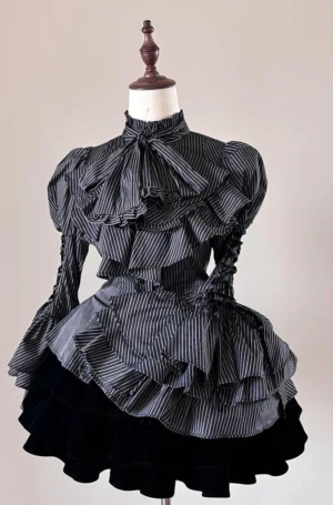 Black base striped Lolita blouse with delicate white stripes showcasing fitted waist, ruffled jabot neckline and lace-up puff sleeve details on mannequin with black velvet skirt